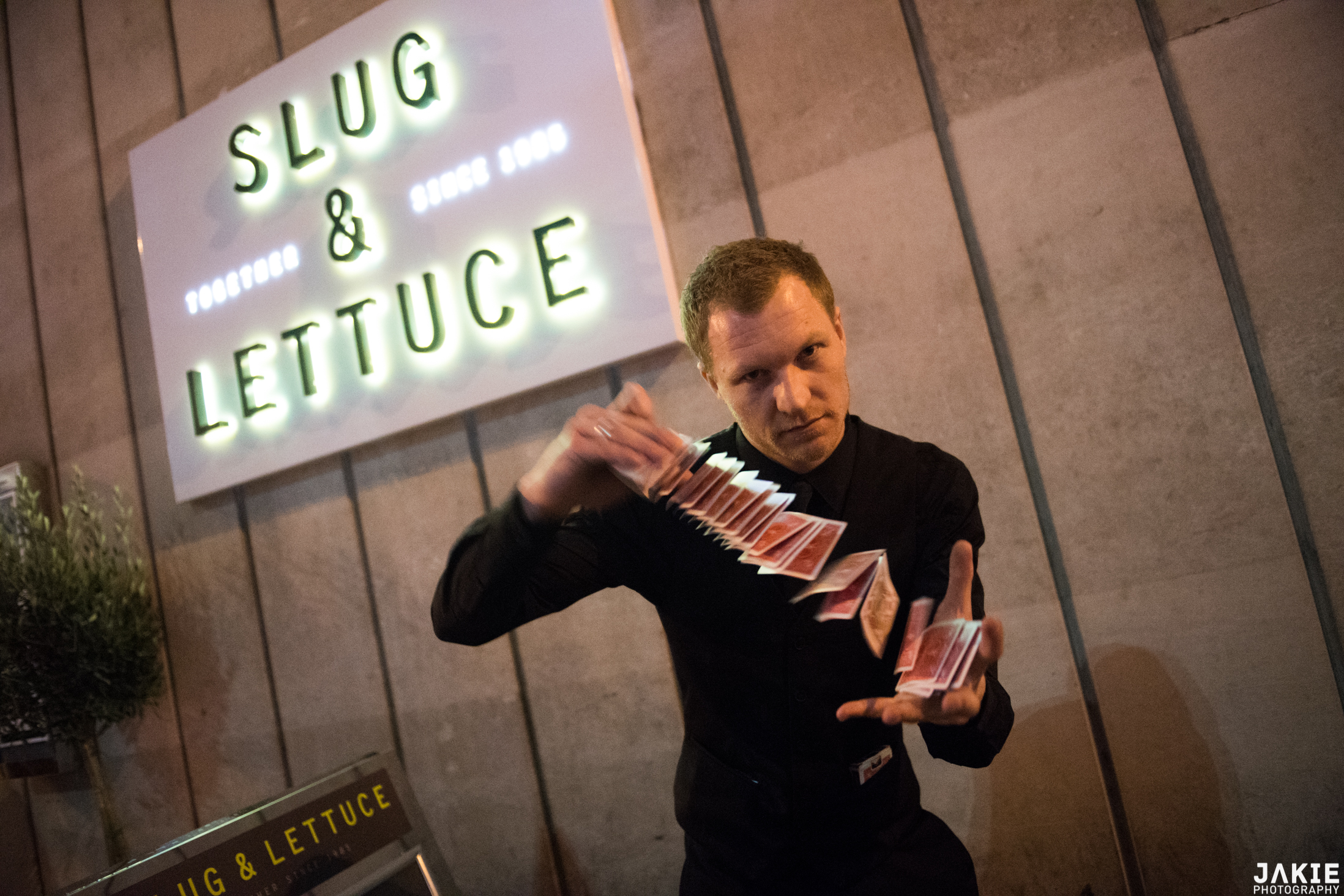 Street Magician Liam Walsh performing close up magic at Slug and Lettuce in London
